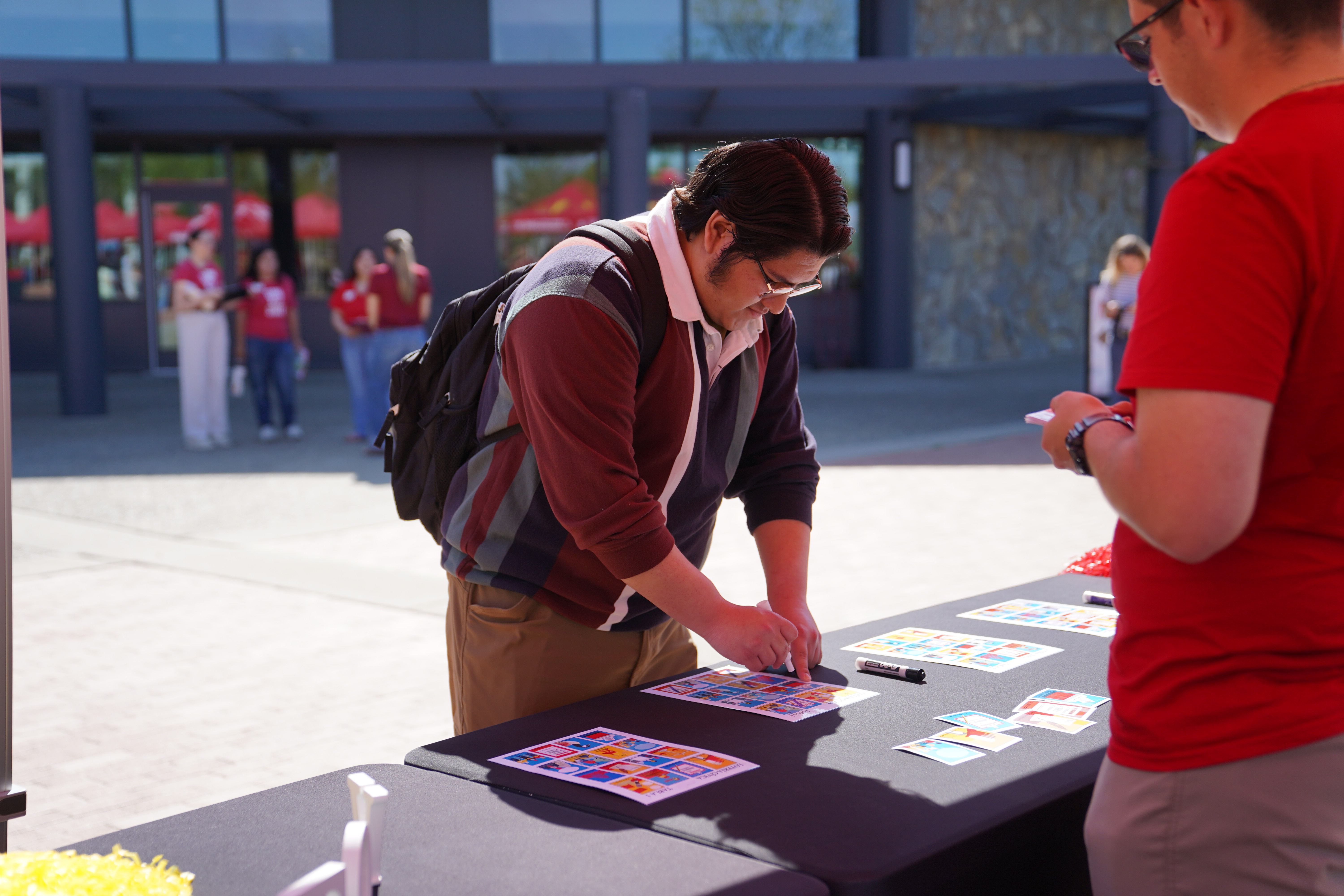 Student playing Loteria in the quad