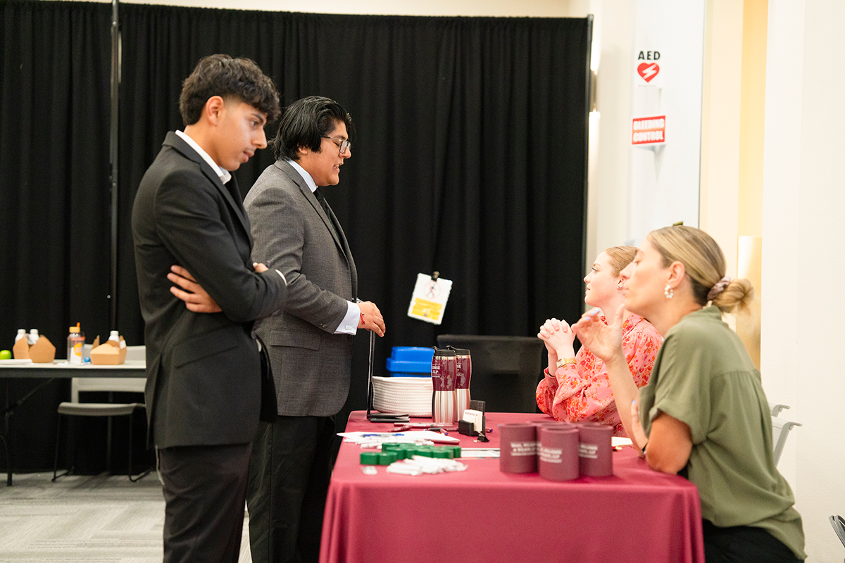 Recruiters speak to students at Meet the Firms Night.