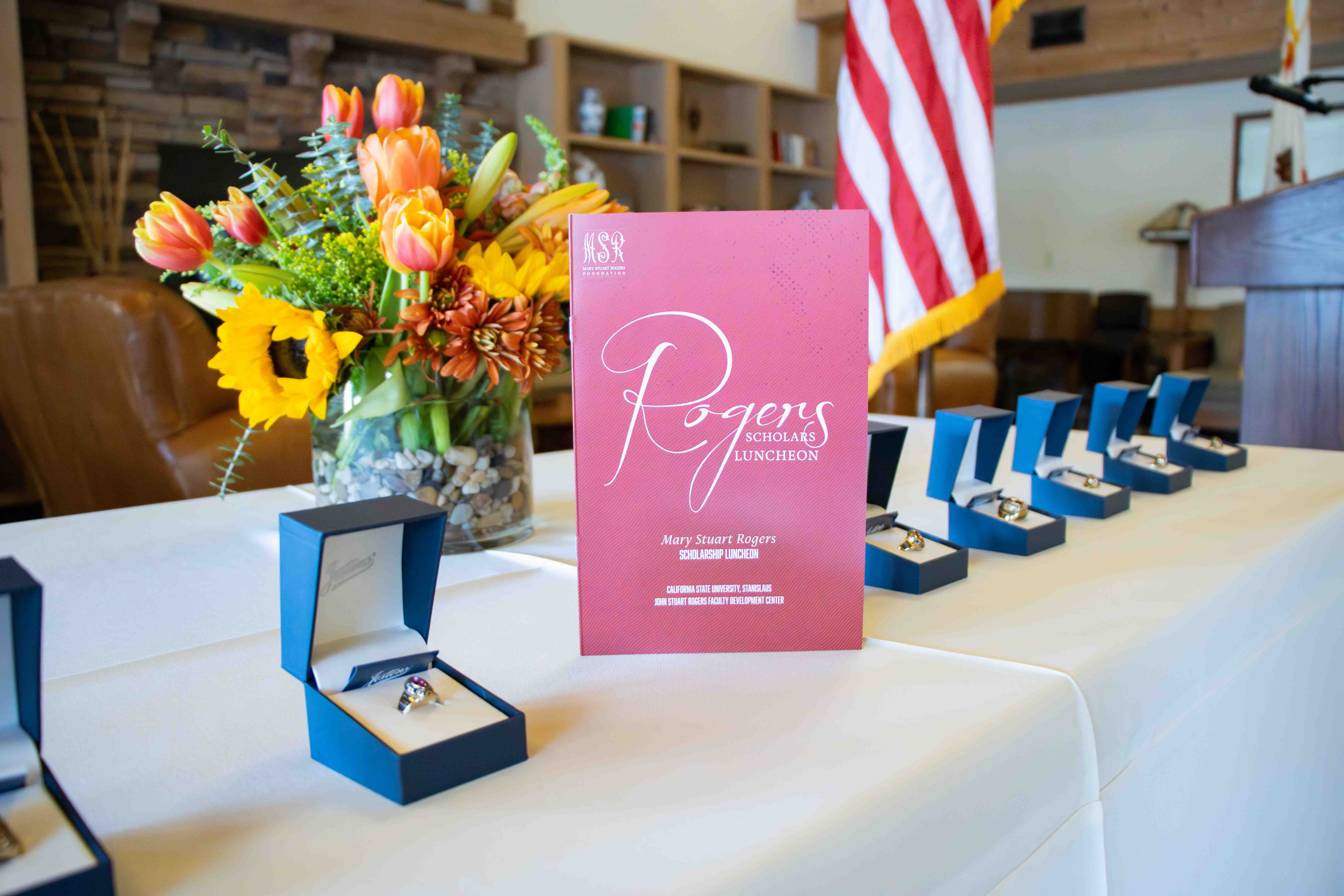 Rogers Scholars program book and recipient rings.