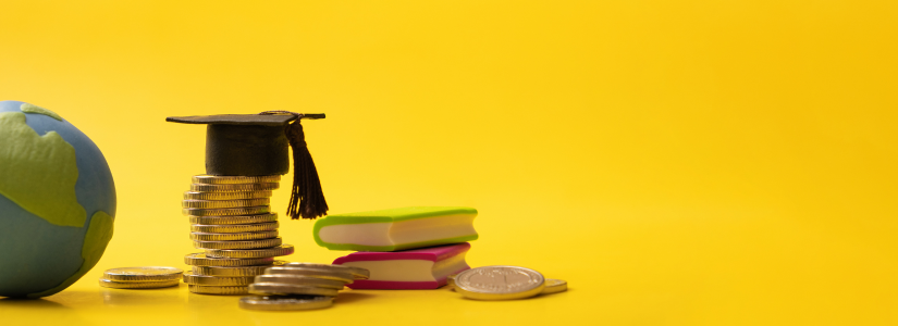 Graduation cap on top of stack of coins