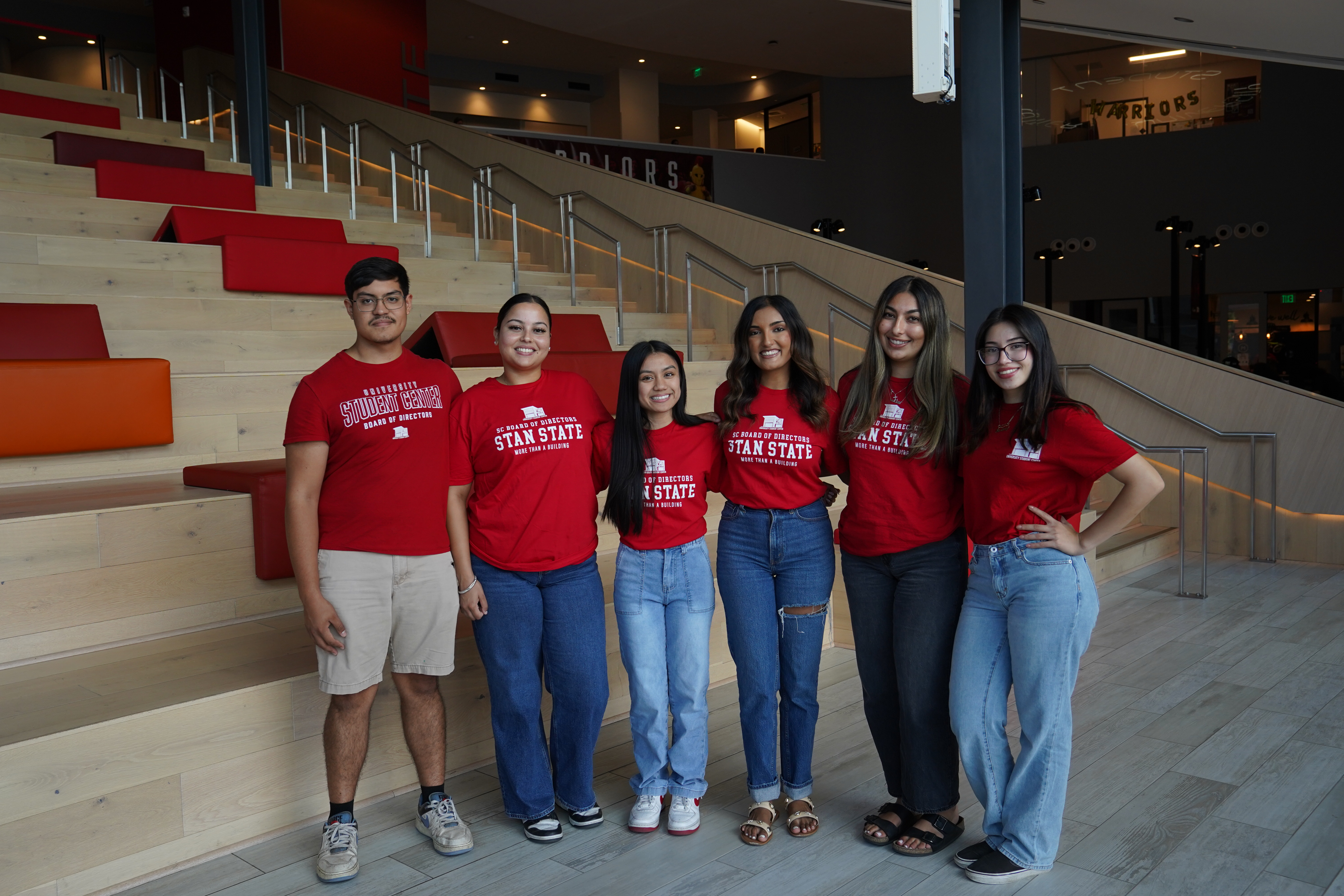 5 Students posing in front of the Warrior Steps