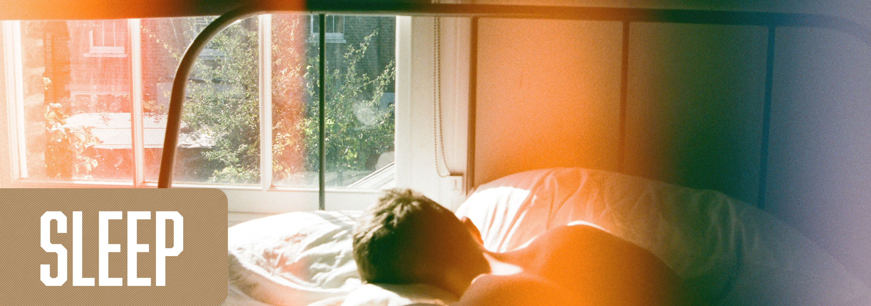 Banner of a young man sleeping in bed, titled, sleep.