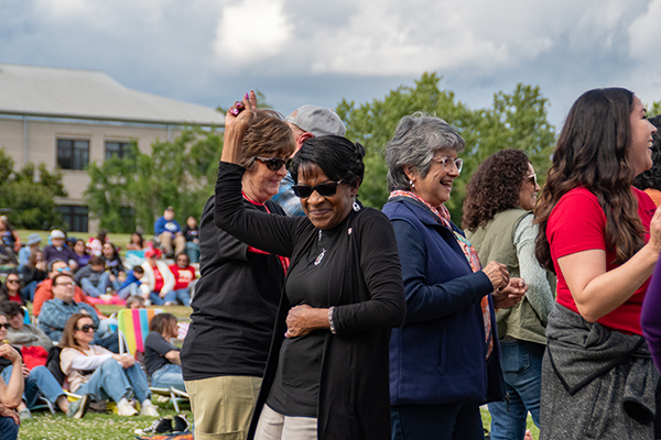staff in crowd at When Doves Cry performance