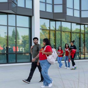 Students walking in Stan State merch