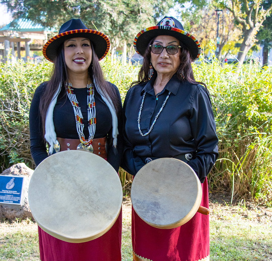 Two members of Sacred Rising Voices, an all-women drumming circle 