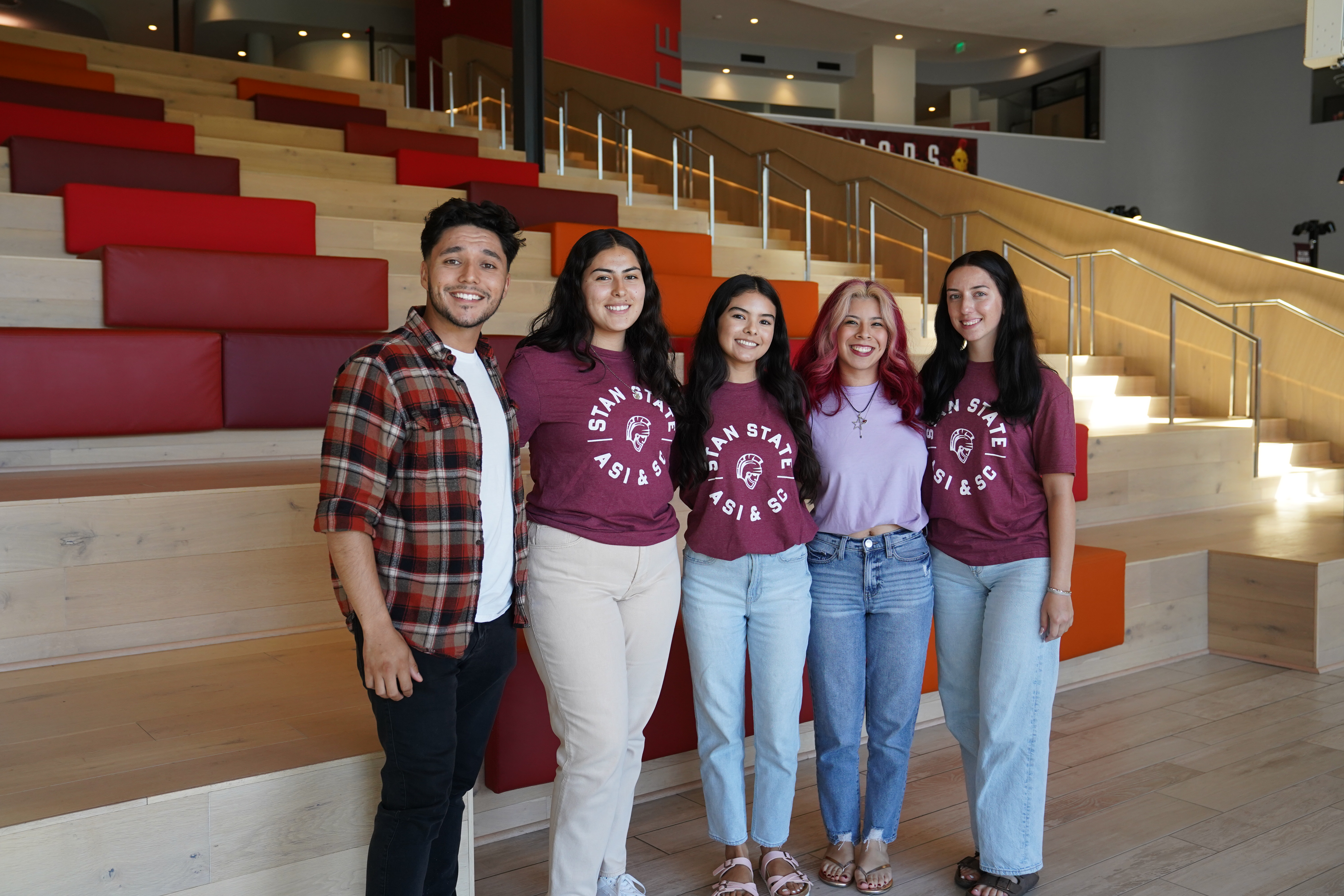 5 students posing in front of the Warrior Steps