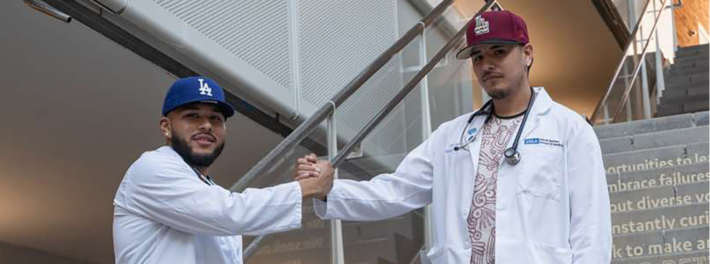 Alexis Aleman and Irvin Garcia Real posed for a photo on a stairway..
