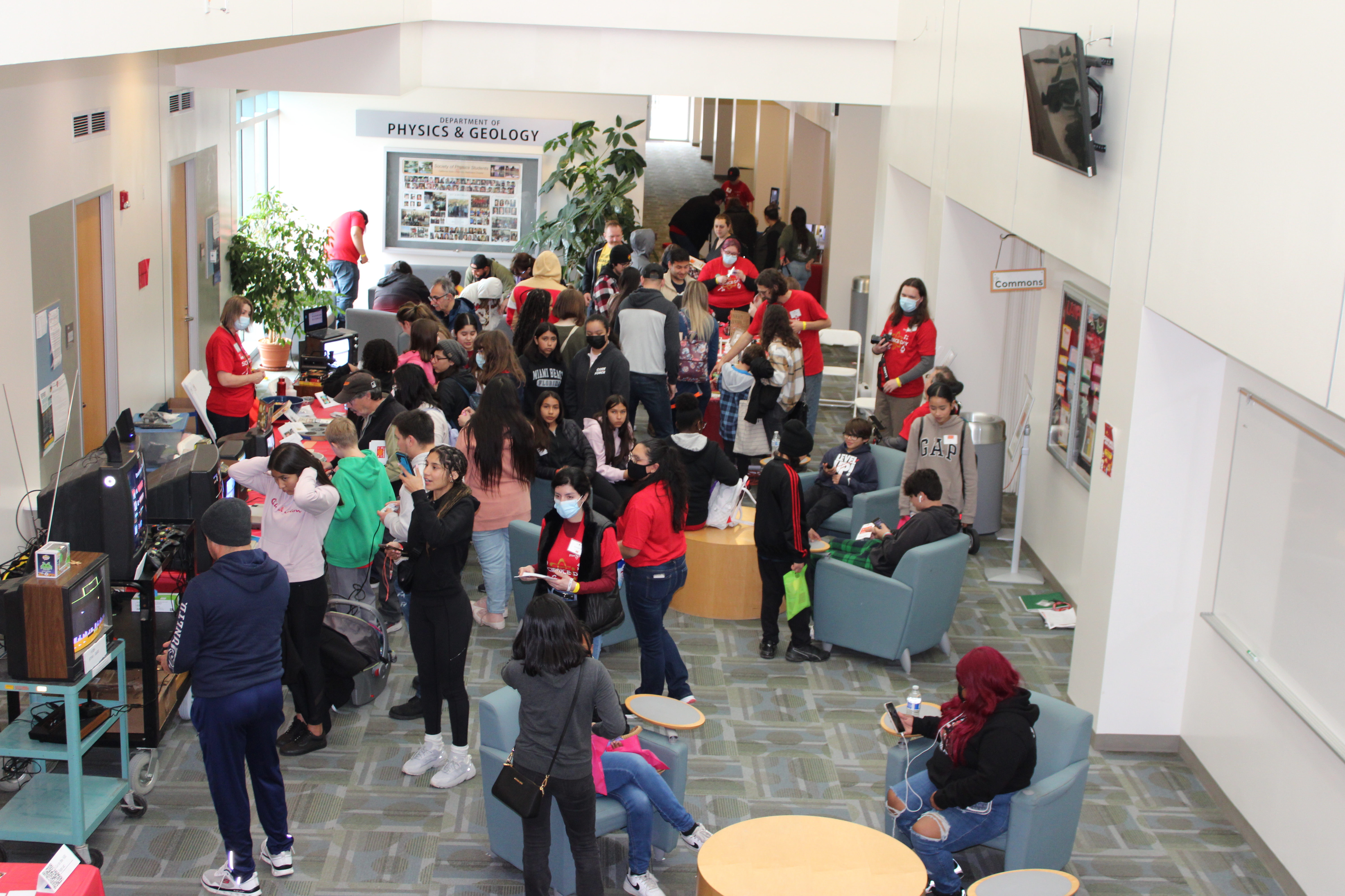 A group gather in Naraghi Hall lobby. 