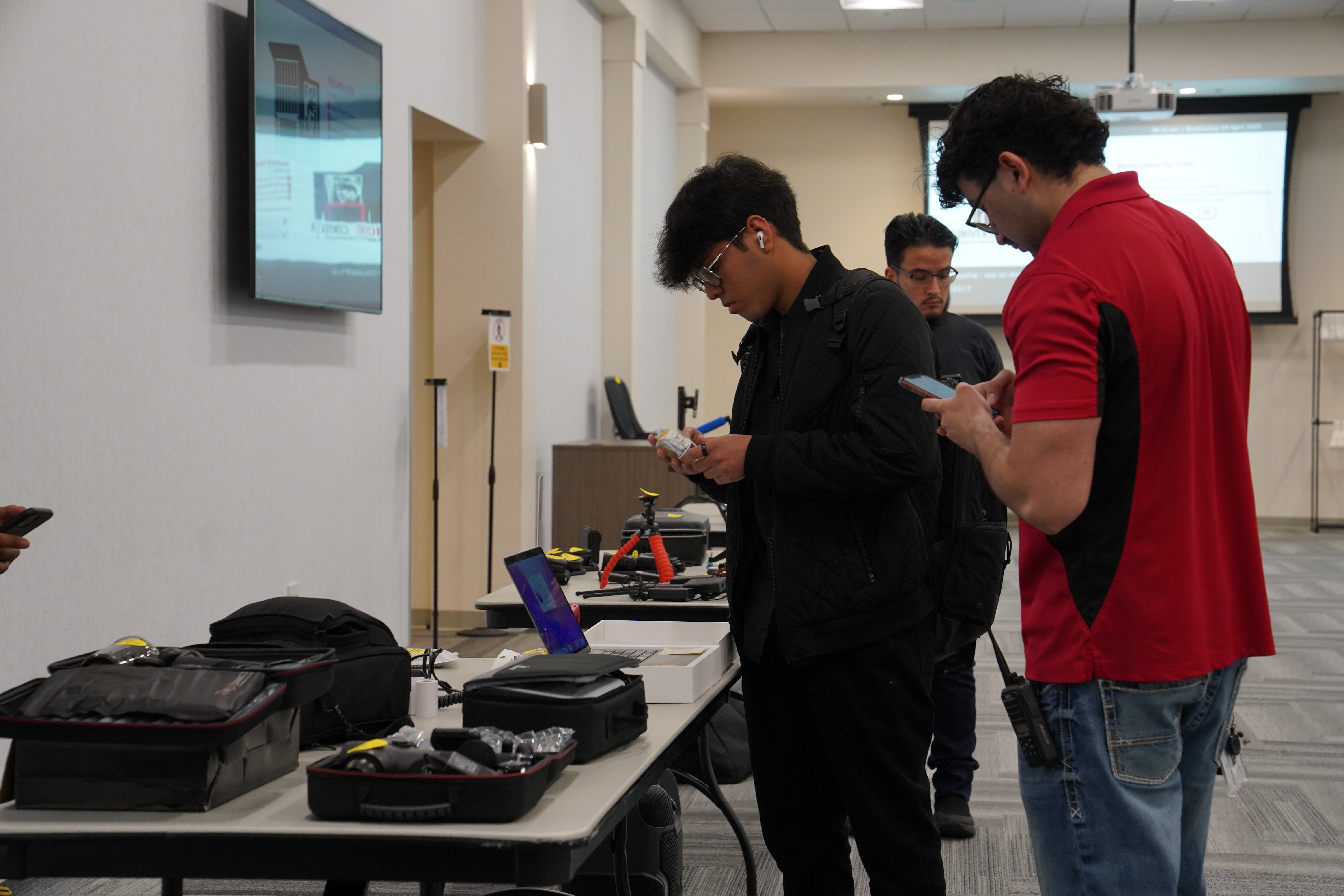 2 students looking at table with inventory 