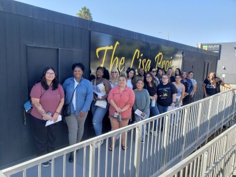 Students standing outside the Lisa Project