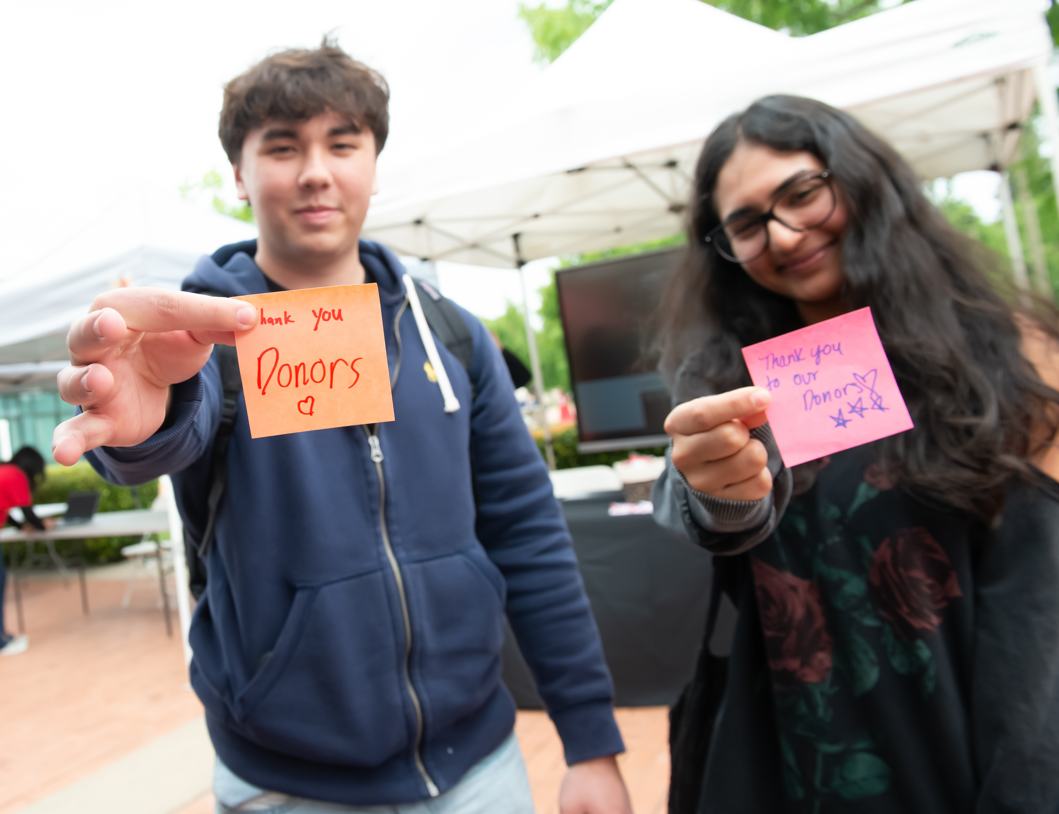 Students holding thank you notes