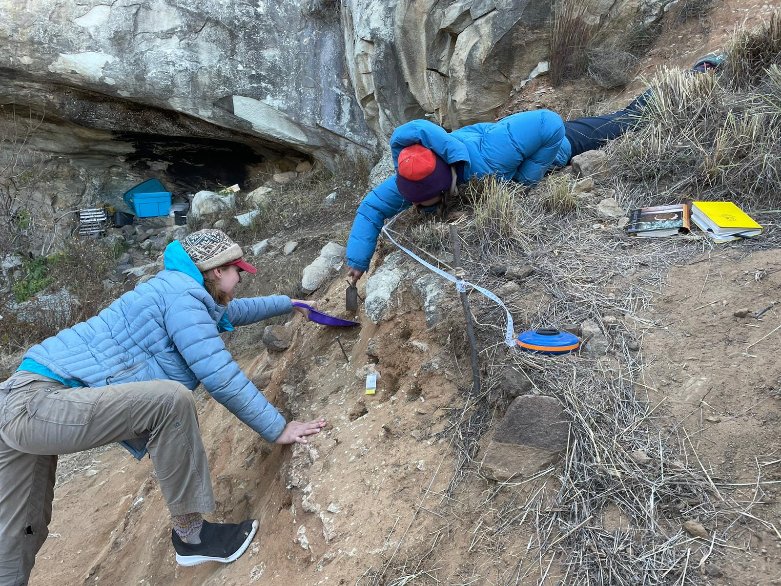 Kristin Cimmerer of University of Toronto, Mississauga, and Kyra Pazan of California State University, Stanislaus, excavate Likonong Rock Shelter in the mountains of Lesotho.   