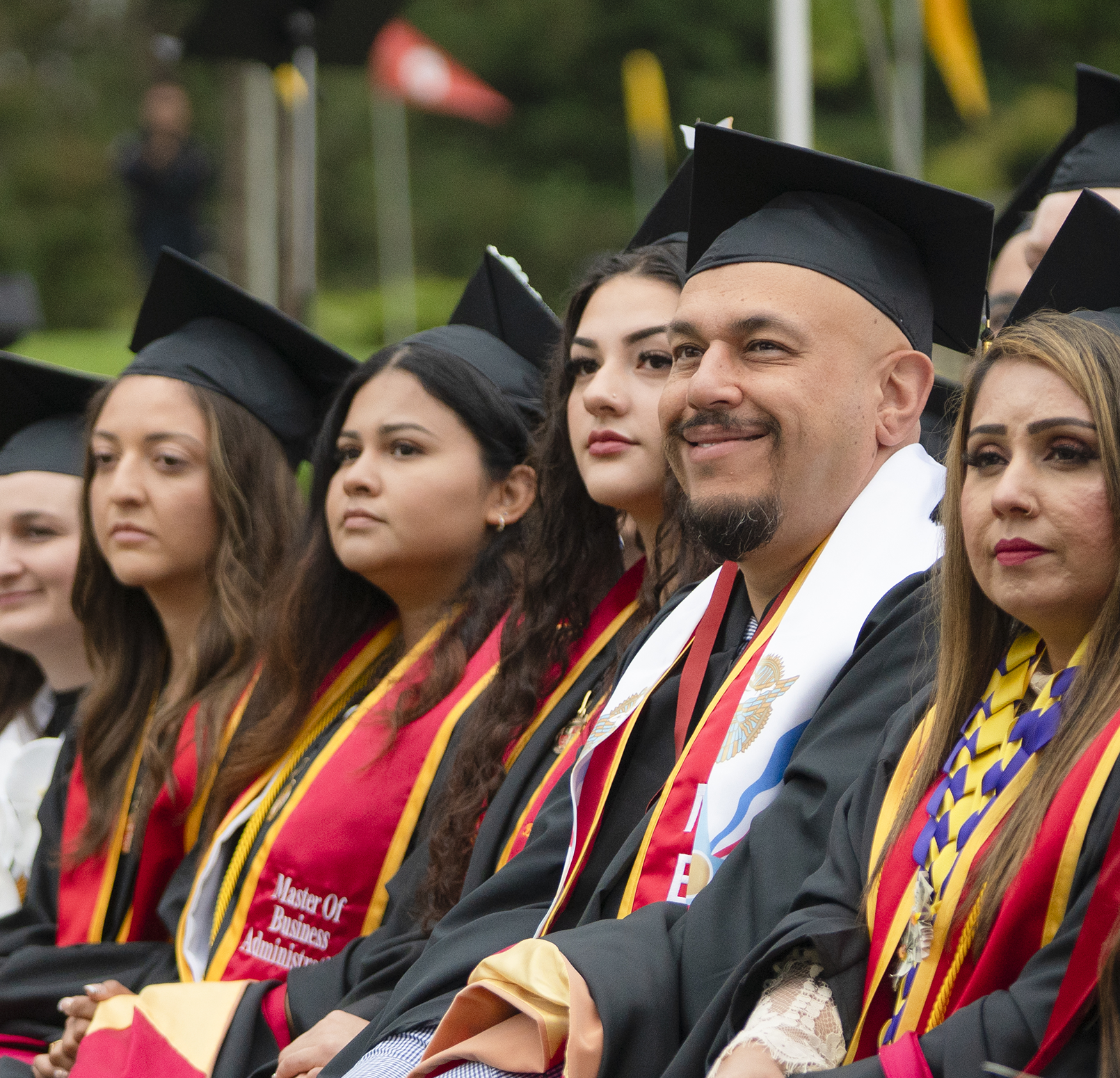 Graduates in academic regalia at Commencement