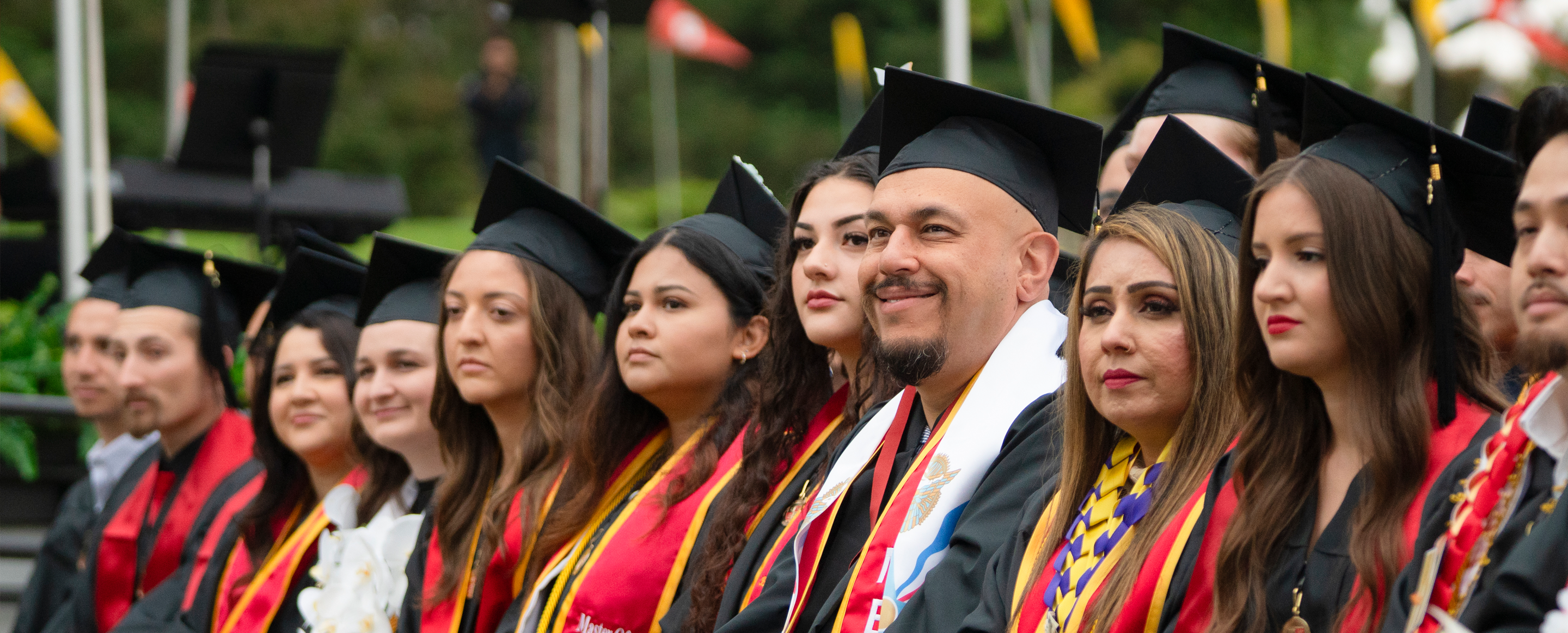 Graduates in academic regalia at Commencement