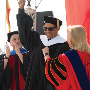 Jacque Wilson is seen on stage with Stan State President Britt Rios-Ellis and Provost Rich Ogele.