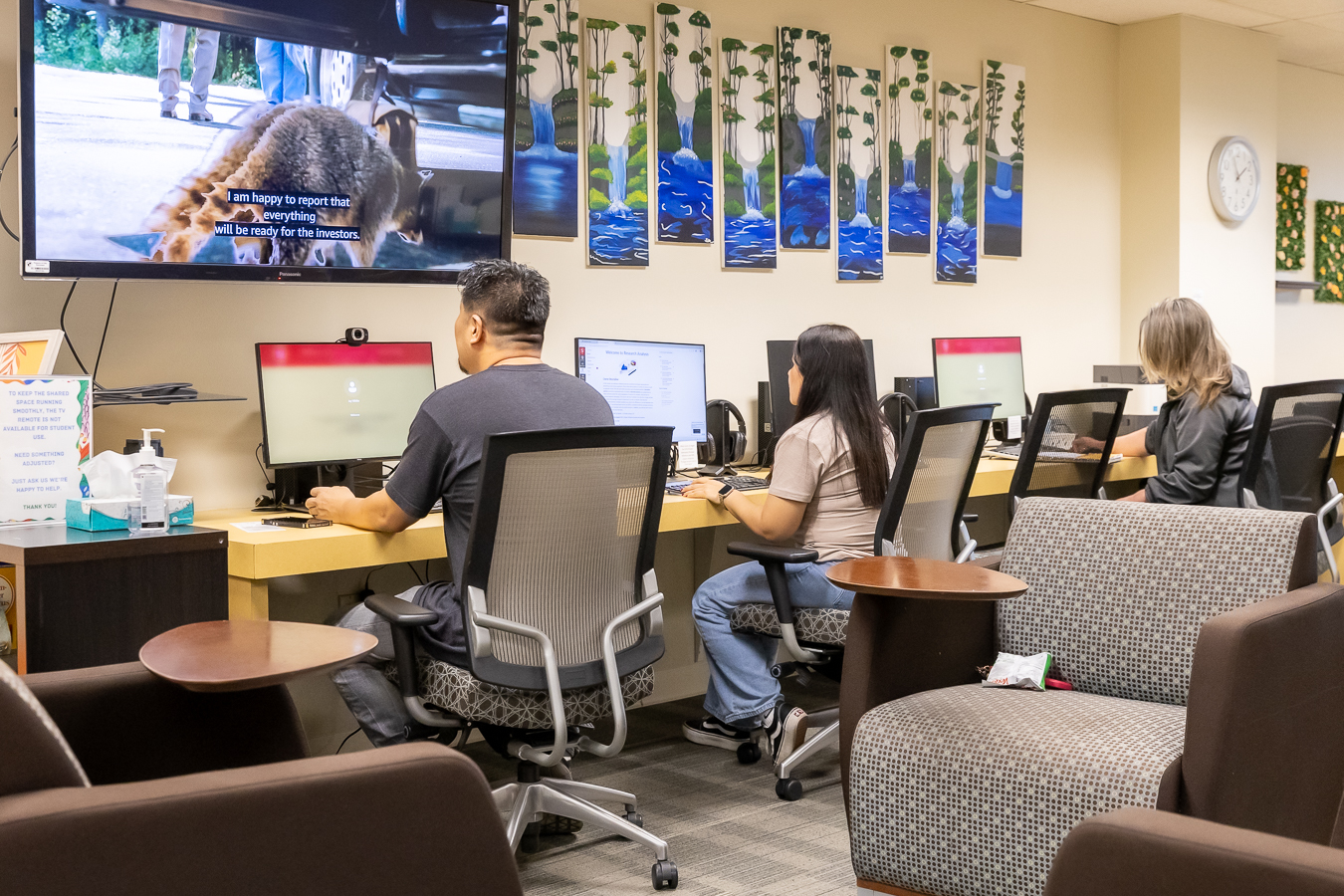 students working at computers in re-engagement center