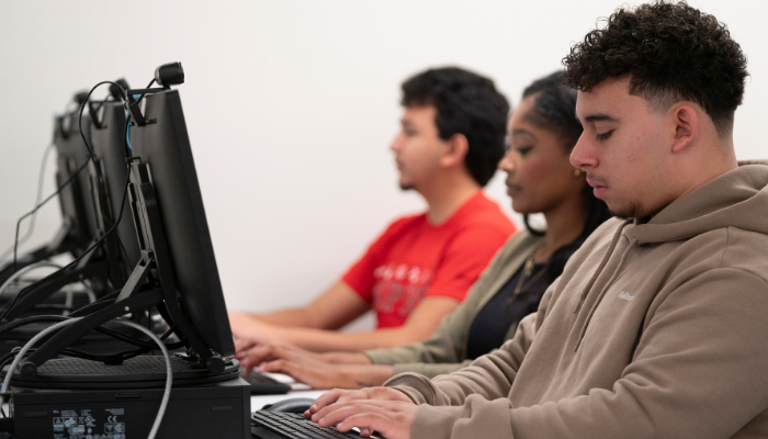 Students working at computers in a classroom