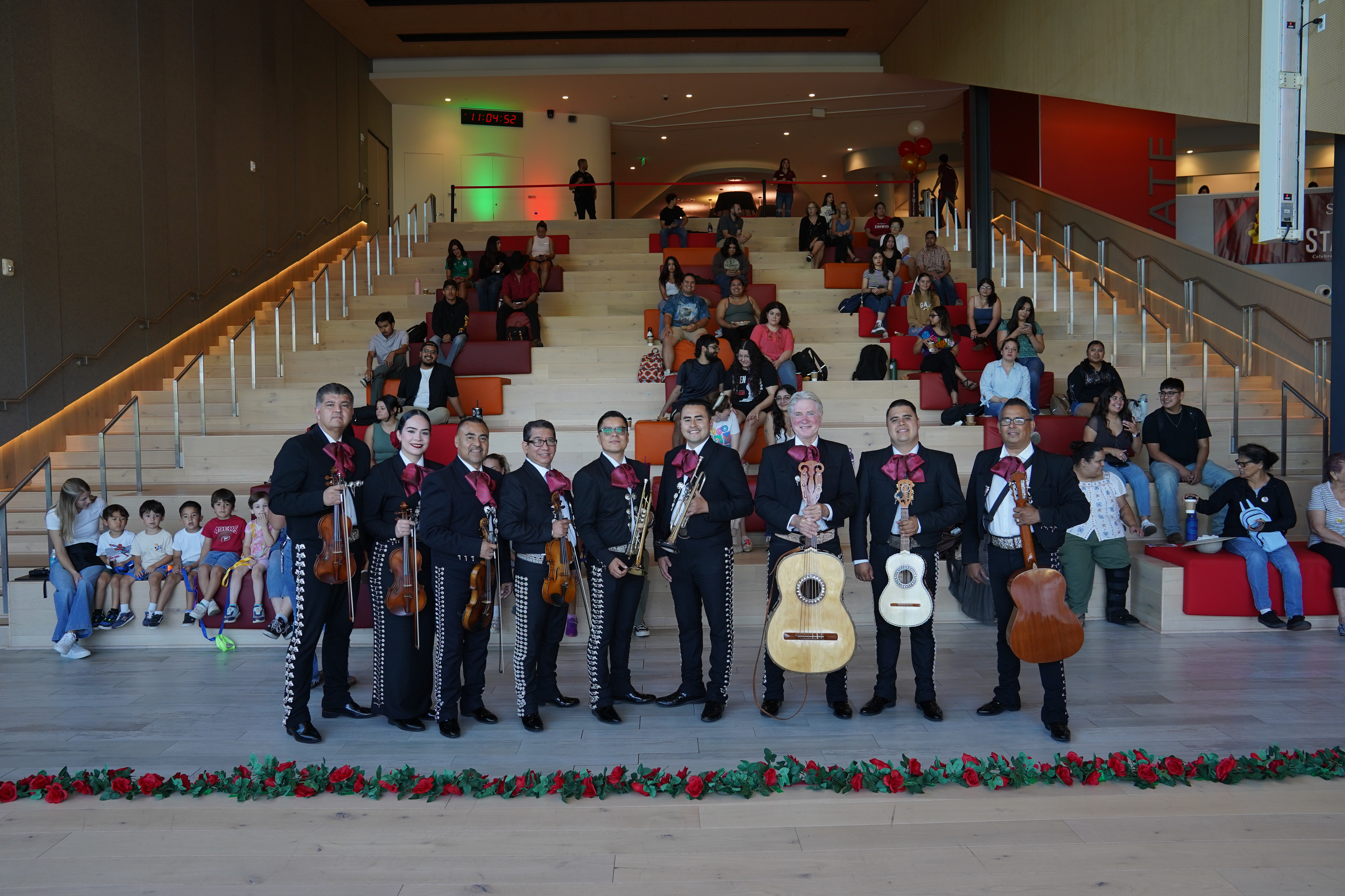 mariachi posing in front of warrior steps