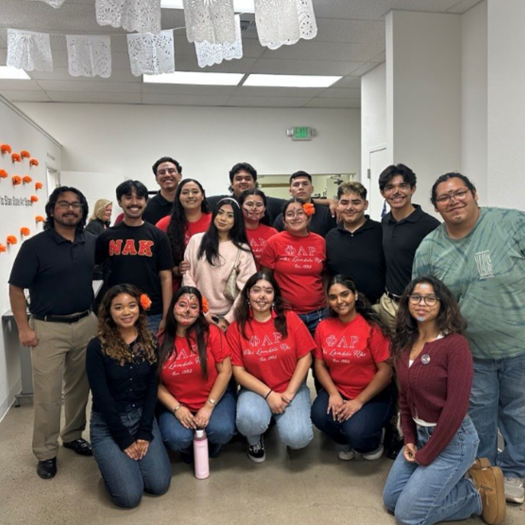 Group of students dressed posed for a picture at a day of the dead event.