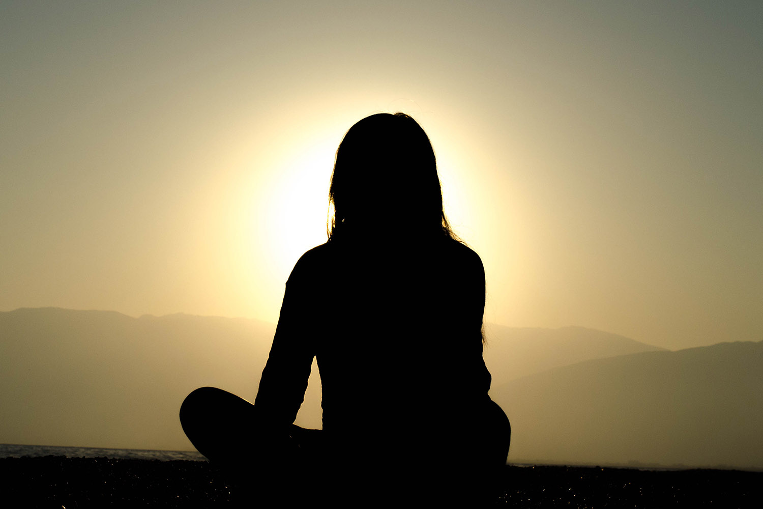 person looking out to the sunset