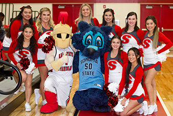 Stan State and Sonoma State mascots with Stan State cheer team