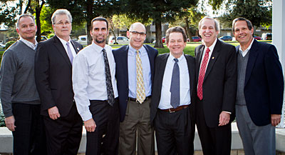 Economist Arthur Laffer (third from right), poses with Winton-Ireland, Strom & Green Chief Operating Officer Rick Adams (from left), CSU Stanislaus Provost James T. Strong, Winton-Ireland Chief Financial Officer Paul Porter, Winton-Ireland Chief Information Officer Michael Ireland, CSU Stanislaus President Joseph F. Sheley and Winton-Ireland Manager Jeff Quinn prior to Laffer’s talk at CSU Stanislaus.