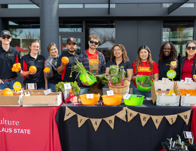 Students at the StanFresh Market event pose together for a group photo.