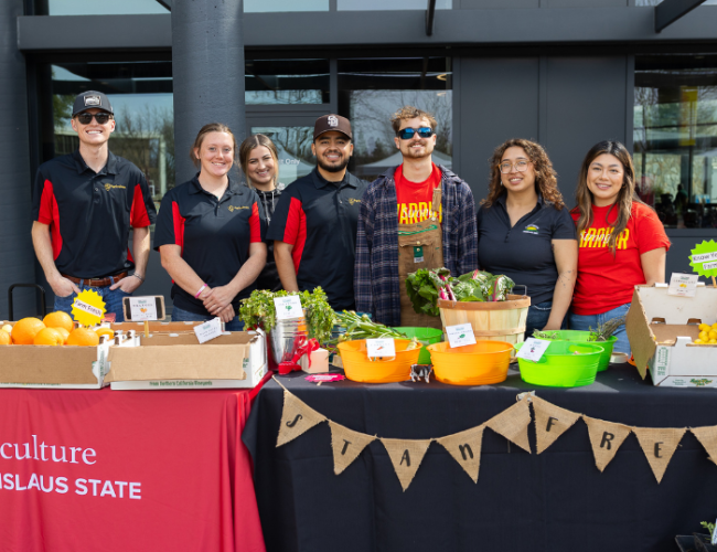 Participants from the StanFresh Market Event pose in a group photo.