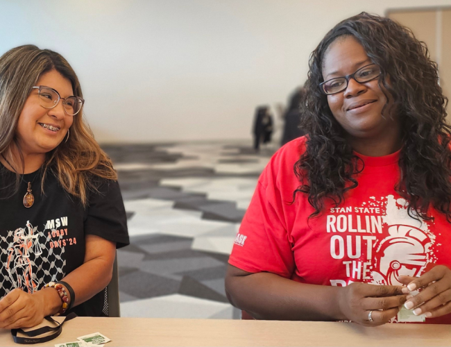 Two MSW Students pose in a group photo.