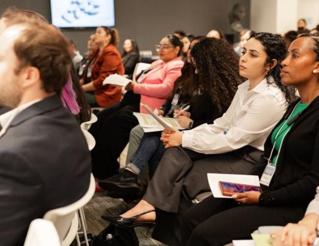 People listening at a conference