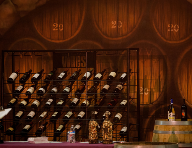 A wine rack displaying several bottles of wine.