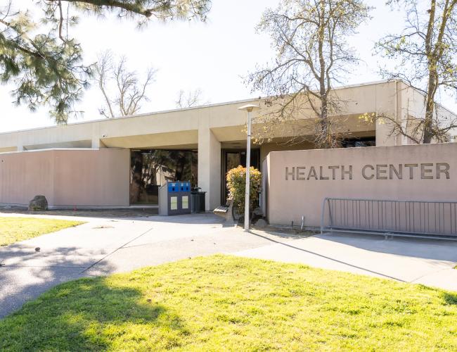 Health center building exterior with sign