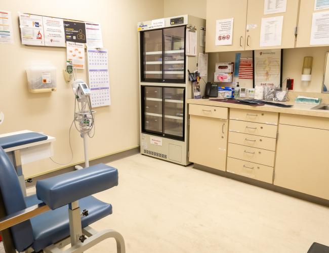Clinical room with blood draw chair and medication refrigerator