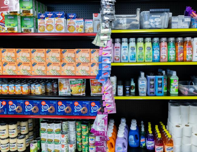 Food pantry shelves with groceries and personal care products