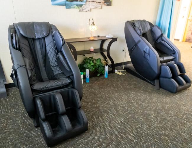 Two massage chairs in relaxation room