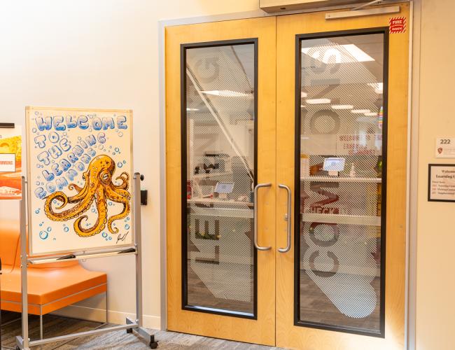 Learning commons entrance doors with welcome octopus sign