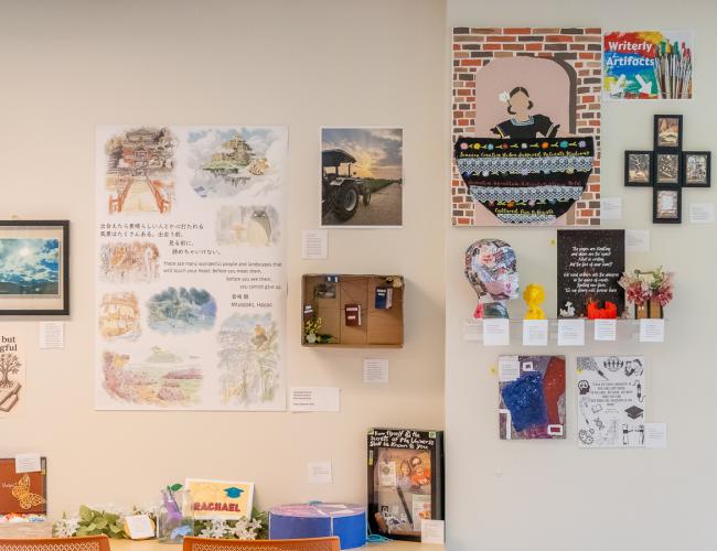 Student artwork display wall with posters and creative projects