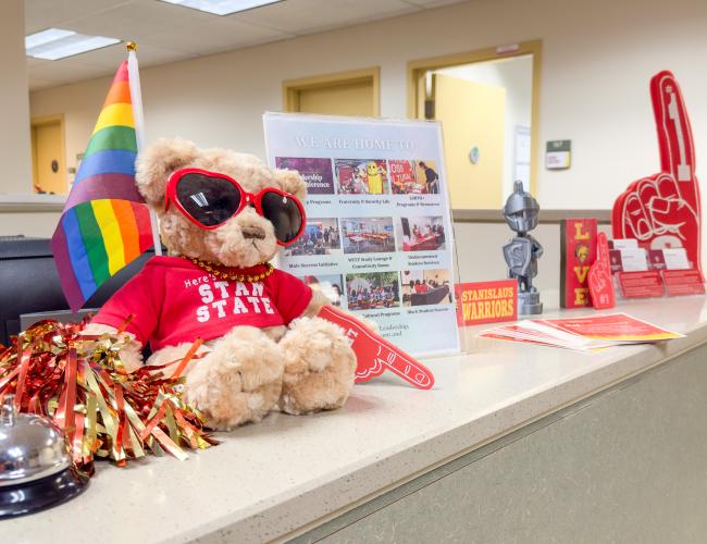 Various Stan State merchandise on an office reception desk