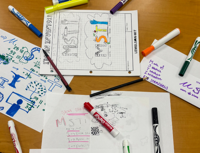 Various sheets of paper with MSTI logo and associated stationary.