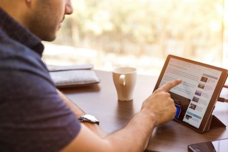Man on tablet.