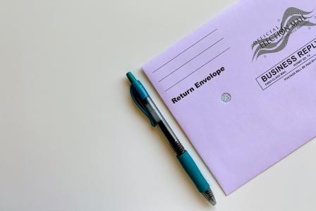 American election mail envelope with pen.