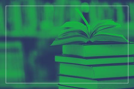 Stack of books with green background 