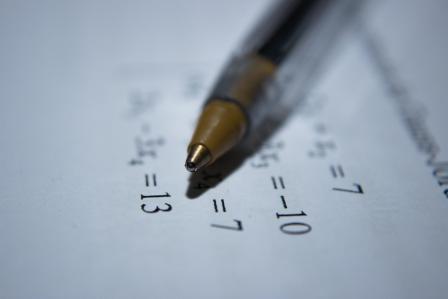 Pen and paper. Math equation
