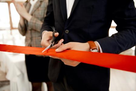 Front view cutting of red ribbon.