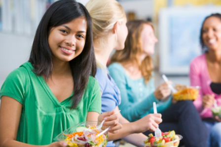 women smiling and eating