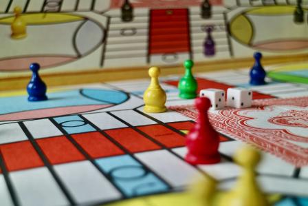 Board game pieces, dice, and cards