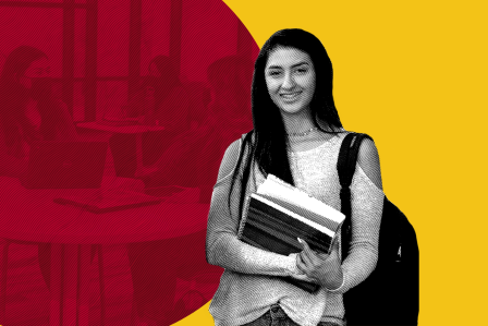 girl standing with books in hand