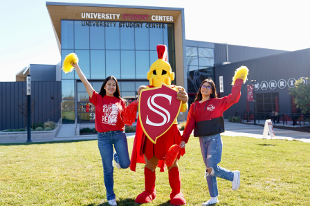 Titus with students on the Warrior Lawn