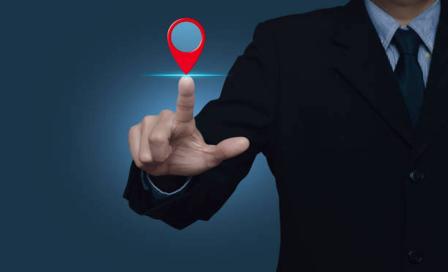 Location pin on a hand