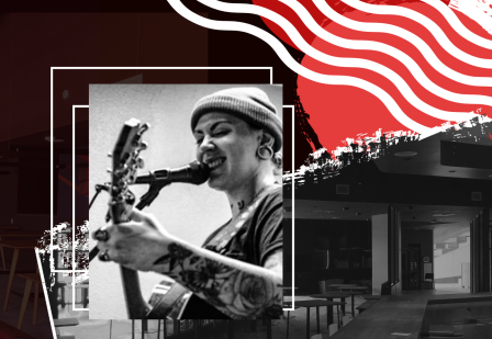 Musician singing with the Warrior Grill in the background